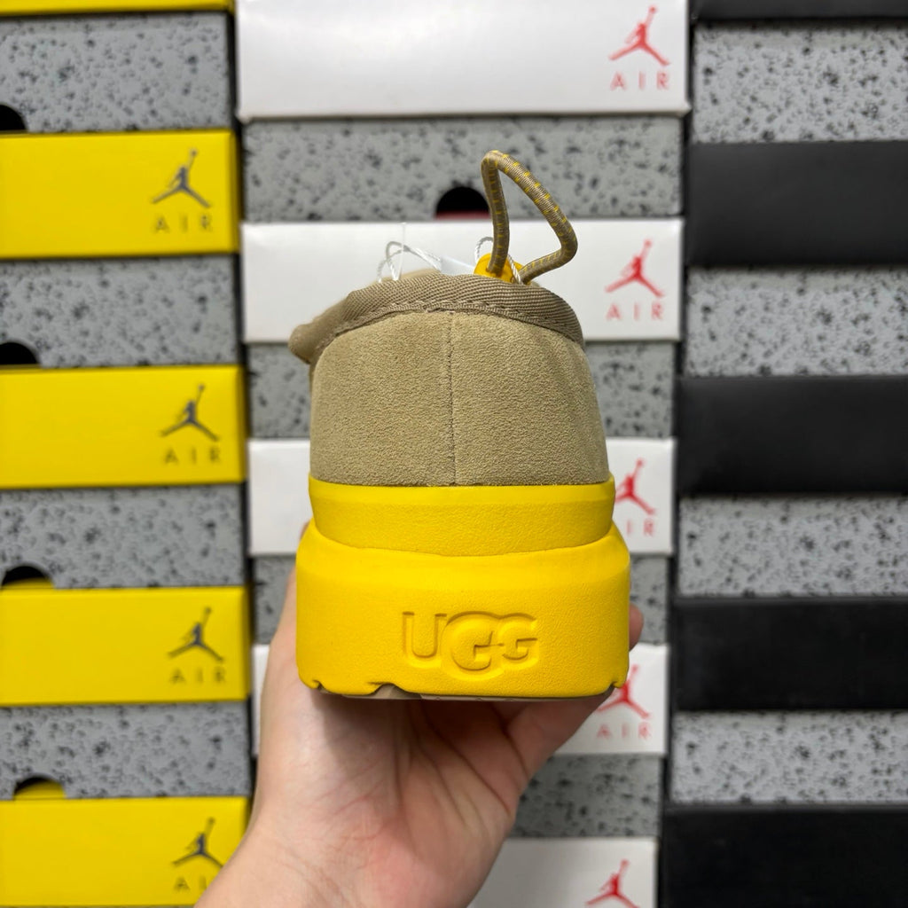 UGG Neumeel Deco Slip-On – Suede Moccasin Sneaker with Yellow Lug Sole & Carabiner Collar in Sand